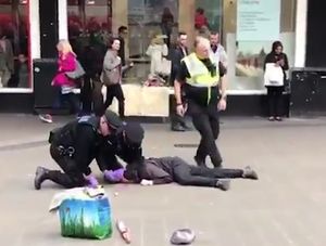 Officers eventually forcibly removed the weapon from his hand