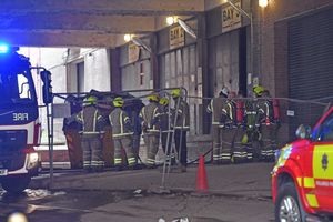 Fire crews respond to the fire in the Beatties building