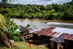 A boat cuts down the river San Juan