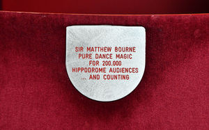 Matthew Bourne with his seat plaque at Birmingham Hippodrome