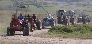 The fleet of Martyn Nicholls tractors, with friend Graham Jones and family in the transport box leading the way