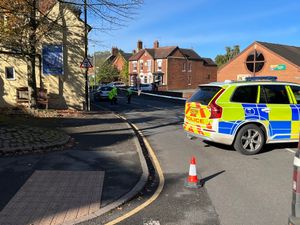 Police examining the scene in Shrewsbury Road, Market Drayton