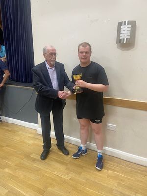 Guest of honour John Cumbers presents Josh Webb, right, with his Open Singles medal