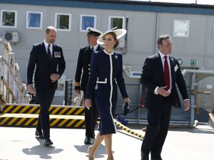 Supporting image for story: Kate names Royal Navy warship by smashing bottle of whisky against hull