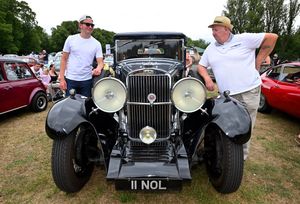 .Melvin Ball and grandson Ben Welborn with their classic 1933 Sunbeam.