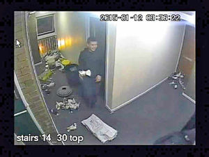 One of the gang appears to grin as he holds a bird