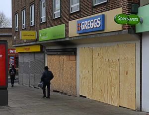 Shops were boarded up to protect them from damage