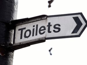 A sign for public toilets in London