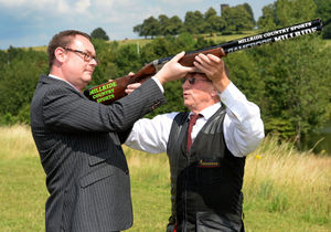 Cyril Brewster shows Mark Andrews who to handle a gun