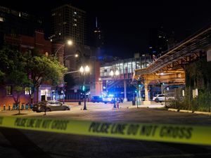 Supporting image for story: Four dead and 14 others wounded in drive-by shooting in Chicago