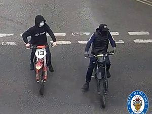 This image has been released of the two motorbike riders caught on camera. Photo: West Midlands Police