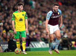 Aston Villa's John McGinn (right) appears injured as Norwich City's Billy Gilmour