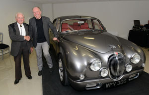 Ian Callum shakes hand with Jaguars legendary test driver Norman Dewis after he unveiled the classic Mk 2 Jaguar at Classic Motor Cars in Bridgnorth