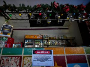 A notice displayed at the bar of Nana Backpack hostel in Vang Vieng