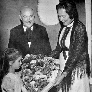 The opening on Thursday, October 7, 1971. Frances Williams presents Councillor Mrs Margaret Shaw with a bouquet on behalf of Wellington Theatre Club. Looking on is Frances' father, Roy, chairman of the club.