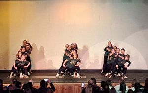 Students from Brewood Middle Academy performing on stage