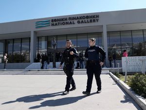 Greek police officers walking outside the National Gallery