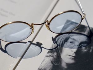 Supporting image for story: Blue-tinted glasses given by John Lennon to be auctioned with Abbey Road photos