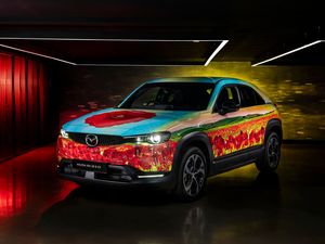Supporting image for story: Mazda creates an MX-30 poppy art car for Race of Remembrance