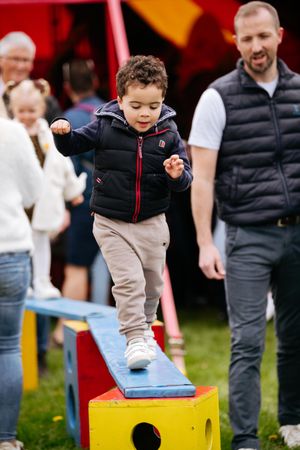 Wilf James, aged three, from Shrewsbury, shows perfect balance, watched on by dad Adam