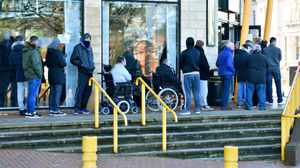 Wolves fans queue for tickets for the FA Cup match with Liverpool