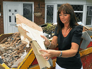 Supporting image for story: Wet weather delays repair work on damaged homes