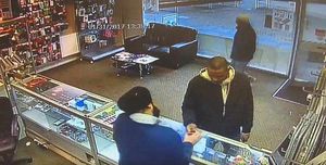 The suspected thief is handed the mobile phone by Jaspreet Singh