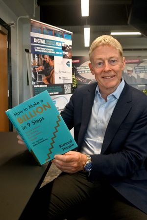 Richard Harpin with his new book How To Make a Billion in 9 Steps pictured at Walsall's Digital Skills Hub run by the Mercian Trust.