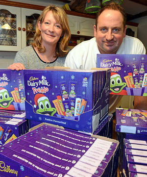 Sally and Stephen Johnson with some selection boxes for the children