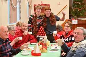  Michael Harris aged 15 and Ollie Garfield aged  18 (standing) who attended the party in Wordsley.
At the table is: Paul Barnes, Michael and Sue Haywood, Elaine Garbett and Roger Brown.