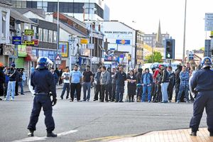 Onlookers in West Bromwich High Street which was closed off during the trouble