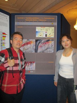 Dr. Xiang Fang (left) and Xinping Hang (right), both from the Nanjing Institute of Geology and Palaeontology, Chinese Academy of Sciences, Nanjing, China, examining a poster at the conference.