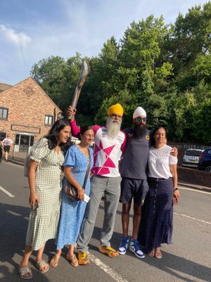 Dementia ambassador and Wolves fan Many Kang with the baton