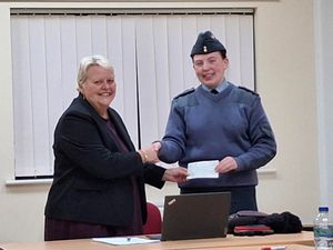 Pictured are Councillor Shirley Reynolds, who chairs Wrockwardine Wood & Trench Parish Council, left, presenting Pilot Officer Lily France, of 83 St Georges Squadron RAF Air Cadets with a cheque for £300. 