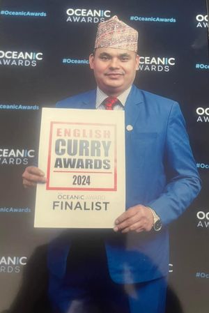 Chef Accepting Award Last Year