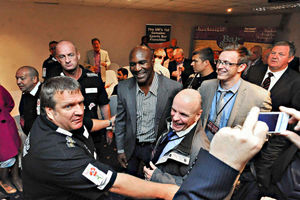 Boxing legend Evander Holyfield shadowed by security staff at the Bar Sport Premier Suite, Cannock