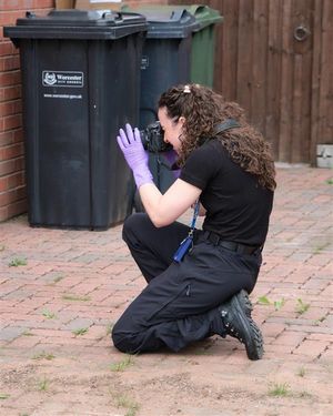 A police Crime Scene Investigator at work.