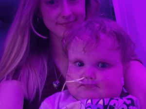 Supporting image for story: Baby Ollie and mum back in the UK after US operation trip from their home in Shropshire