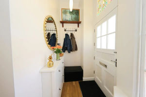 The hallway space is simple but stylish with room to hang coats and leave shoes and bags. Photo: Zoopla