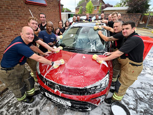 Supporting image for story: Firefighting family unites to honour father-of-two Iain Hughes who went missing during charity swim