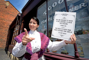 Lizzie Whitehouse reminds guests to 'cover yowr fairce' before entering the sweet shop