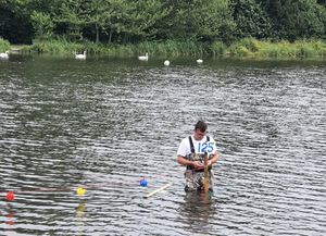 Stone skimming championships co-organiser Sam Angell marking out the lane