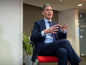David Miliband, president and chief executive of the International Rescue Committee, speaks during an interview with the Associated Press in Washington