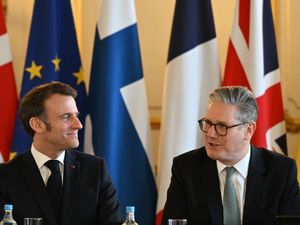 French President Emmanuel Macron and Prime Minister Sir Keir Starmer talk ahead of a plenary meeting during a European leaders’ summit on the situation in Ukraine at Lancaster House, London