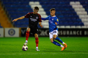 Tom Bloxham of Shrewsbury Town and Calum MacDonald of Stockport County (AMA)
