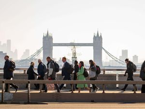 Commuters walking across London Bridge