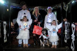 The Bridson family with Jenson the dog, who won first prize in the fancy dress competition, being presented with their prize by Llandrindod Wells Mayor Councillor Marcia Morgan. Image: Andy Compton
