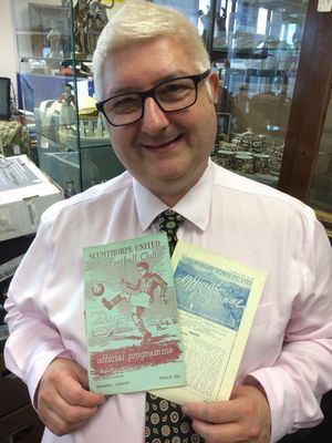 Alistair Lofley with some of the rare Shrewsbury Town programmes.