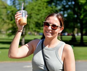 Ashleigh Hall cools off with a cold drink at Mary Stevens Park in Stourbridge. Photo: Tim Thursfield