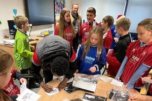 Children wearing football shirts donated through the Kitmas appeal 